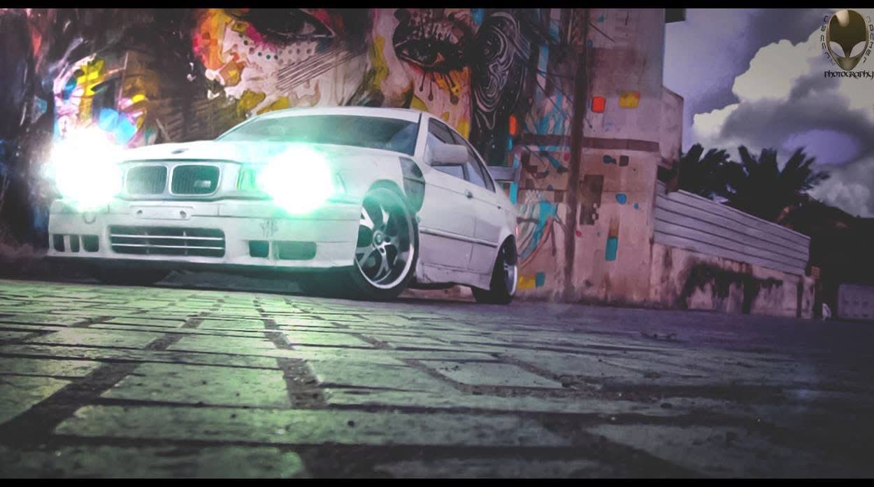 Multi-exposure composite: BMW E36 against a painted wall